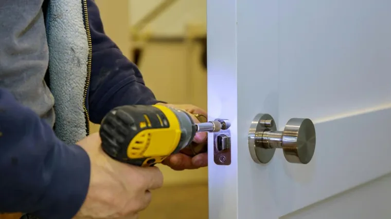 Door hardware being installed